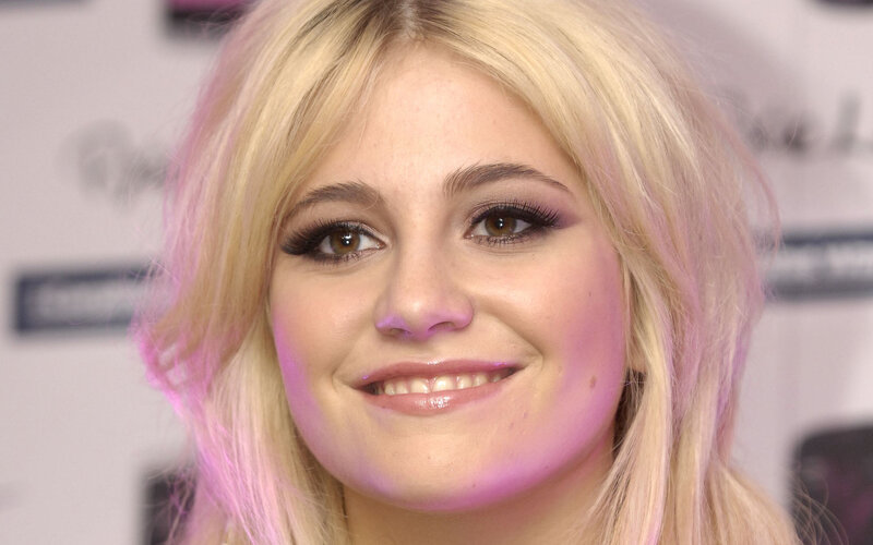 blonde woman smiling at event