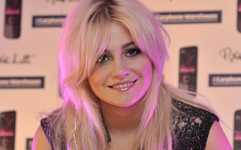 blonde woman smiling at event