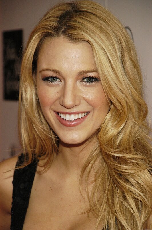 Blonde woman smiling at event