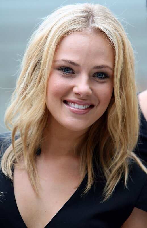 Blonde Woman Smiling — Happy, Photograph, Black Top, Blue