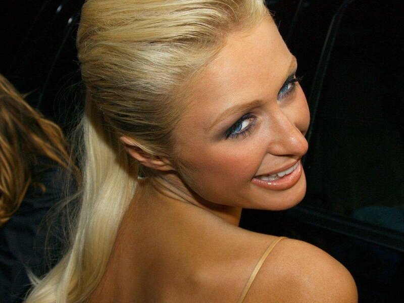 blonde woman smiling in car