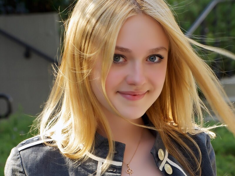 blonde woman smiling outdoors