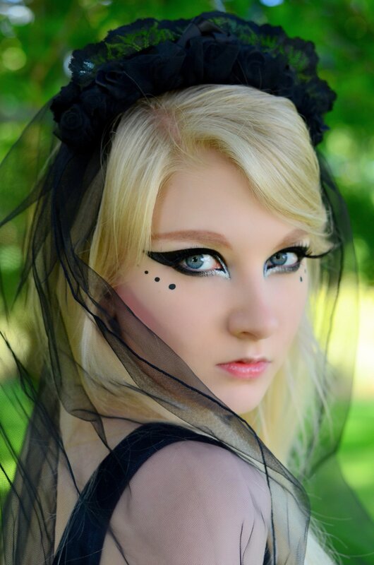 blonde woman with black veil