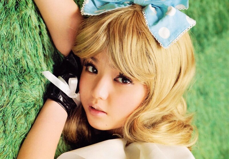 blonde woman with blue bow