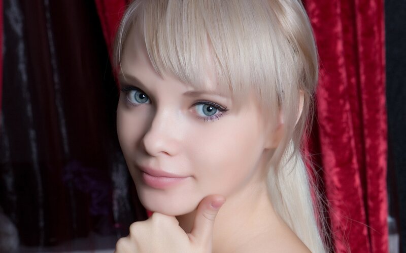 Blonde Woman with Blue Eyes — Red, Dramatic