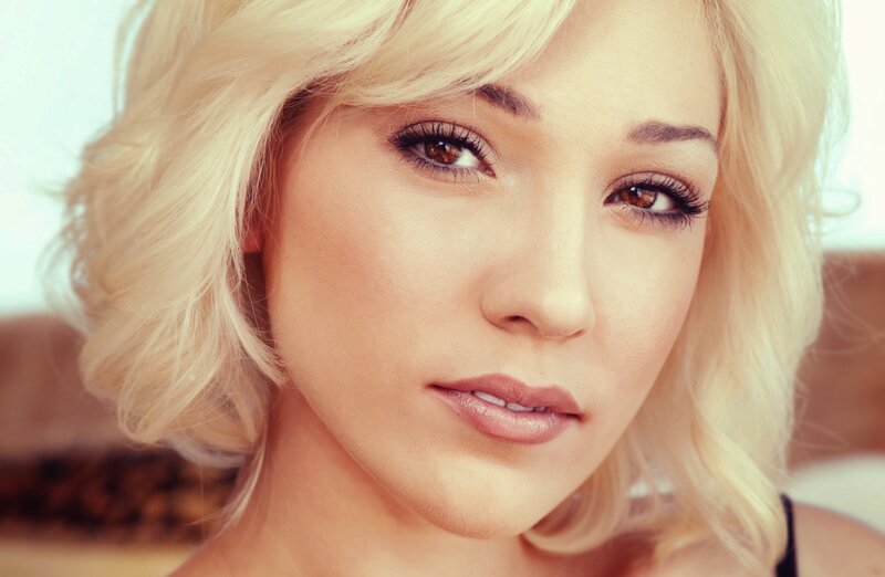 blonde woman with brown eyes