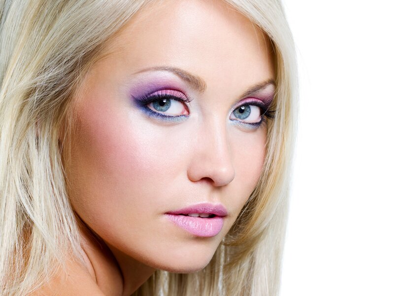 blonde woman with colorful makeup