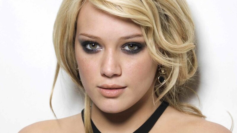 blonde woman with dark eye makeup