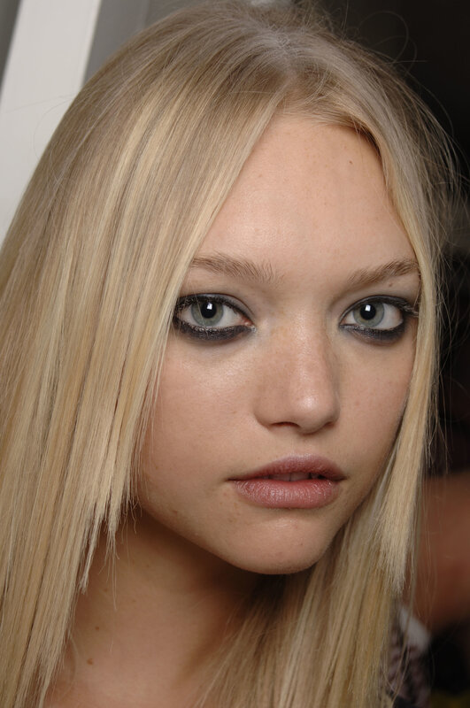 blonde woman with dramatic eye makeup