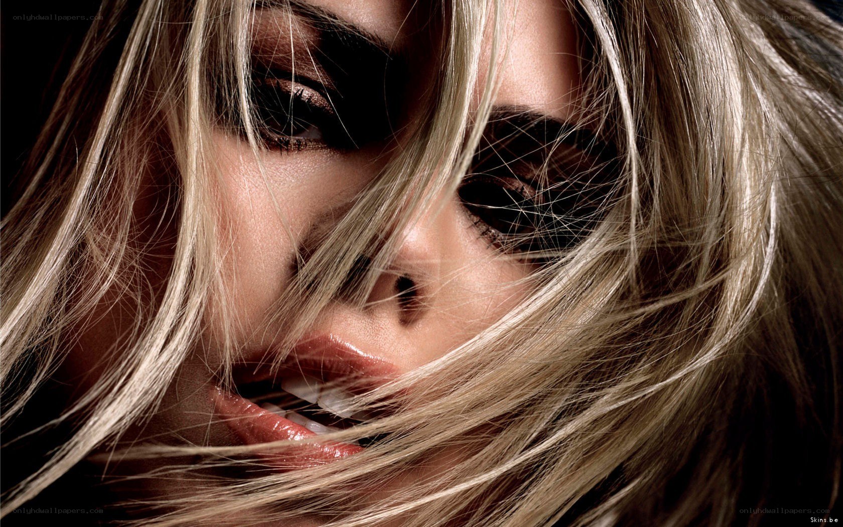 blonde woman with dramatic makeup