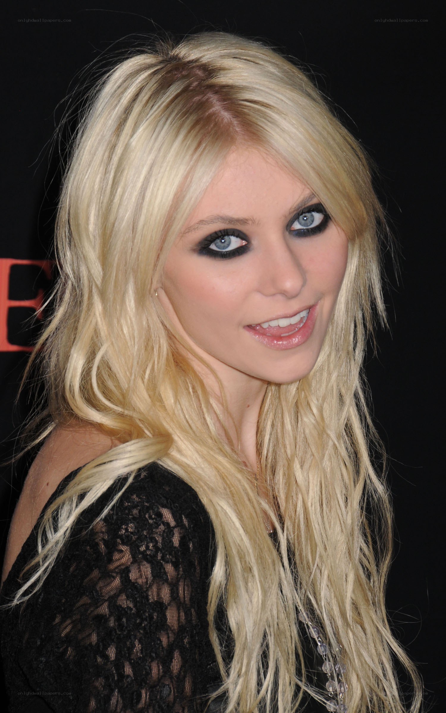 blonde woman with dramatic makeup