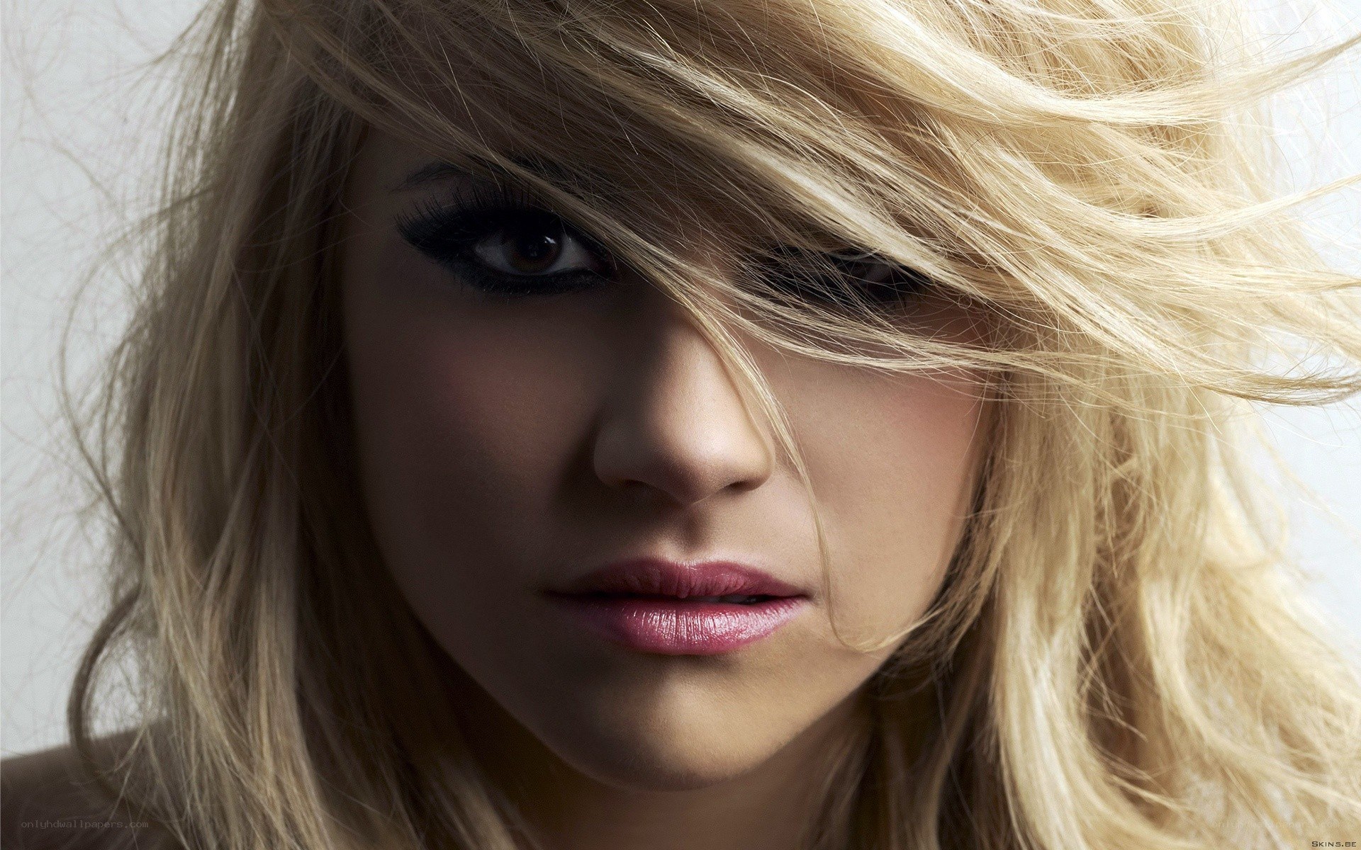 blonde woman with dramatic makeup