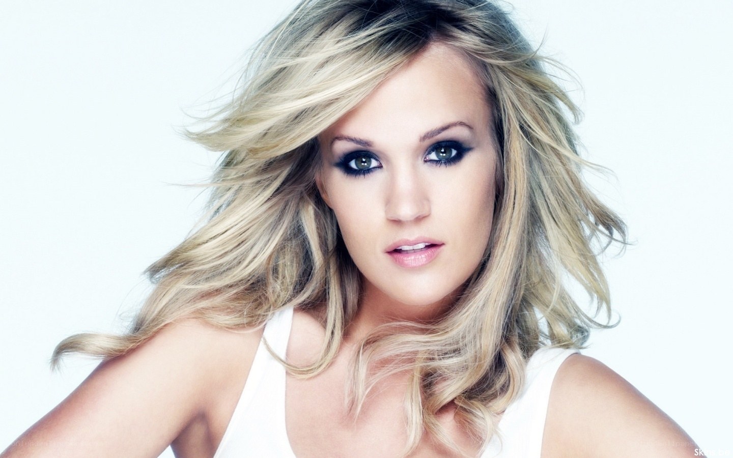 blonde woman with dramatic makeup