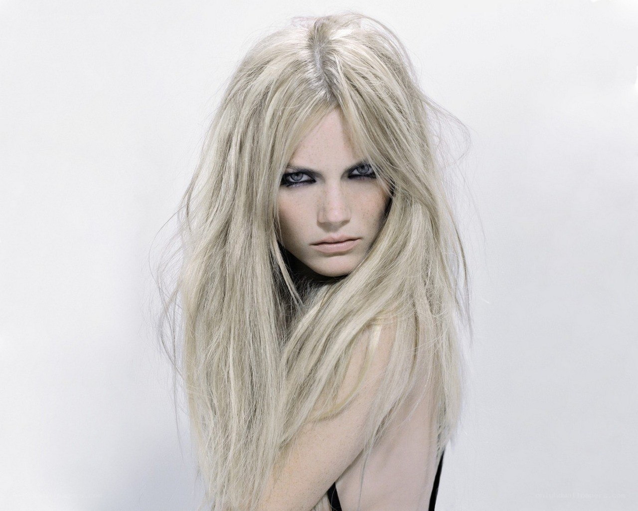 blonde woman with dramatic makeup