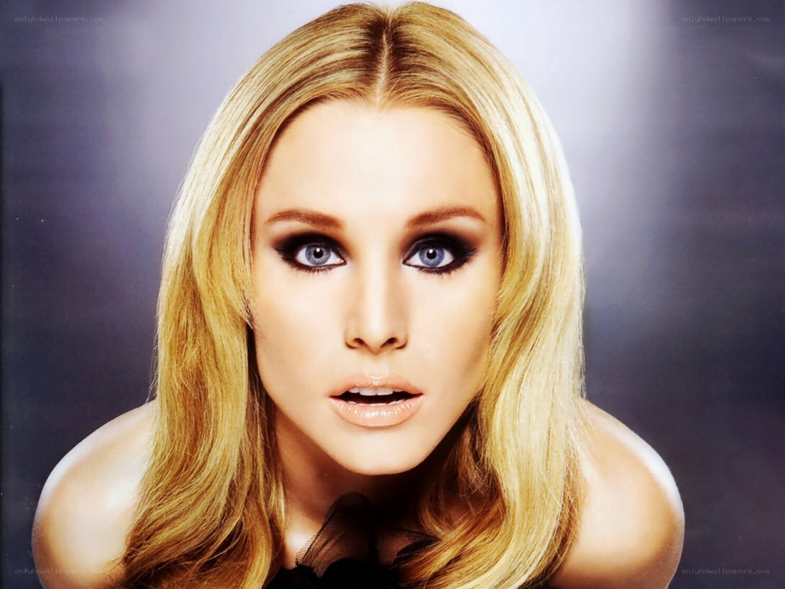 blonde woman with dramatic makeup