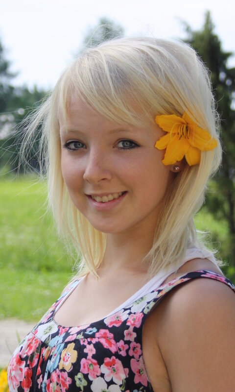 blonde woman with flower