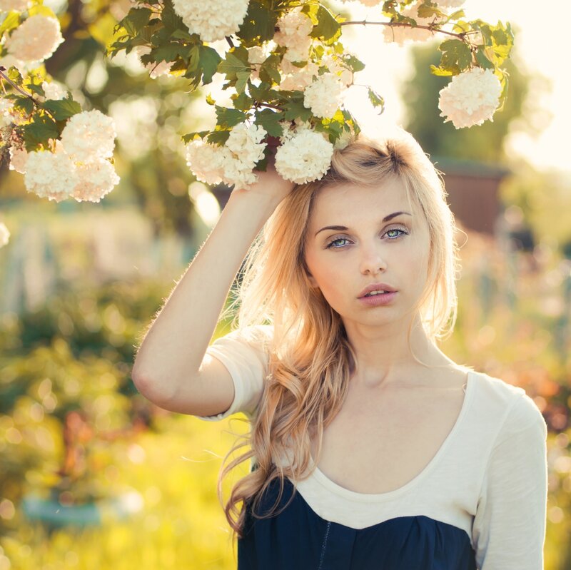 Blonde Woman with Flowers — White, Serene, Afternoon