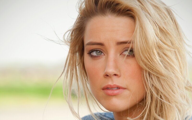 blonde woman with green eyes