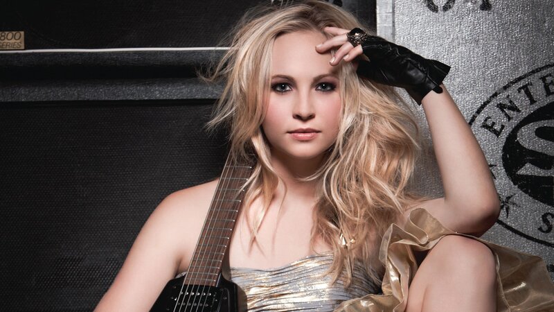 blonde woman with guitar