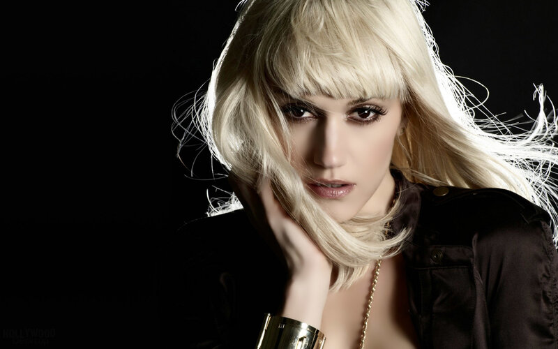blonde woman with hand on cheek