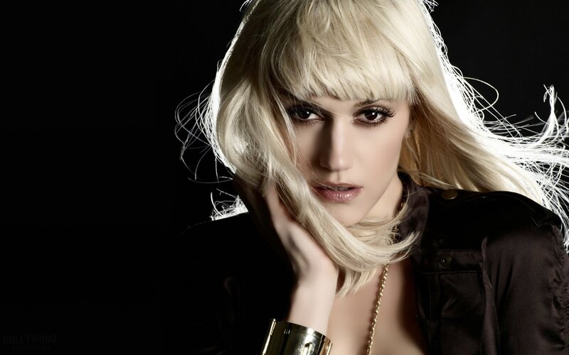 blonde woman with hand on face