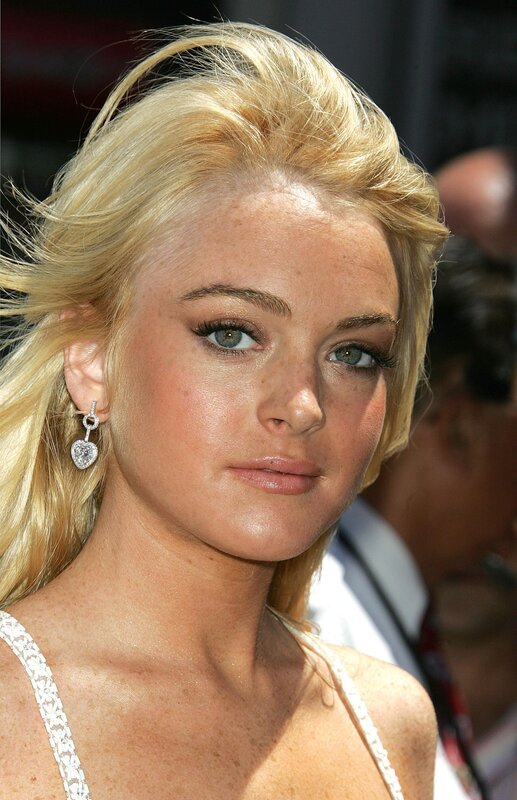 blonde woman with heart earrings