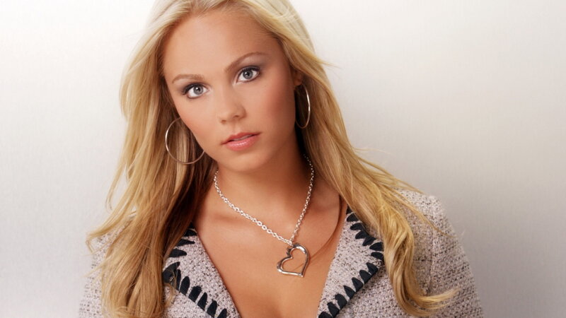 blonde woman with heart necklace