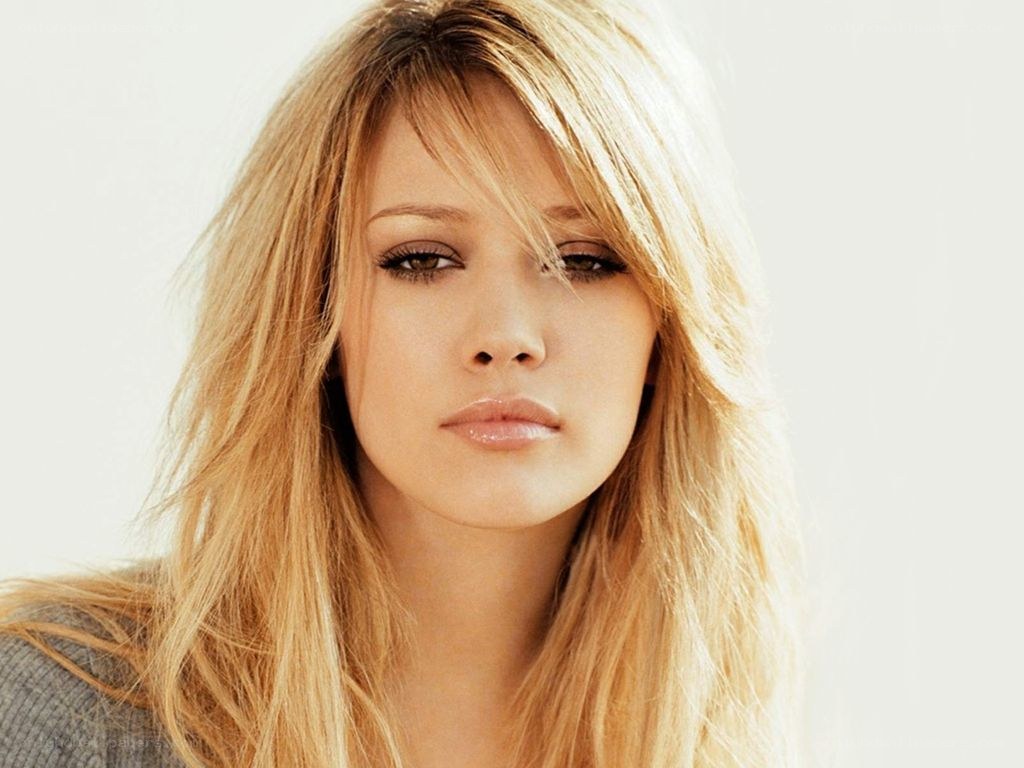 blonde woman with neutral expression