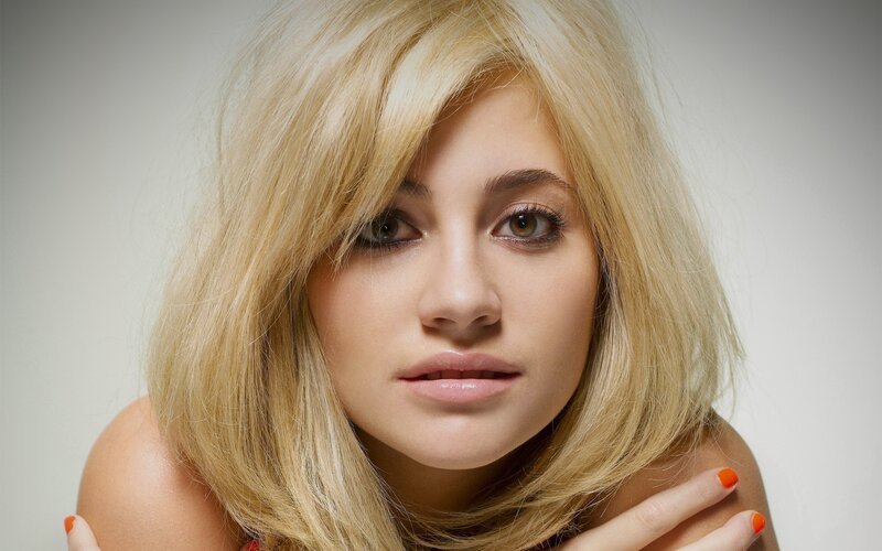 blonde woman with orange nails