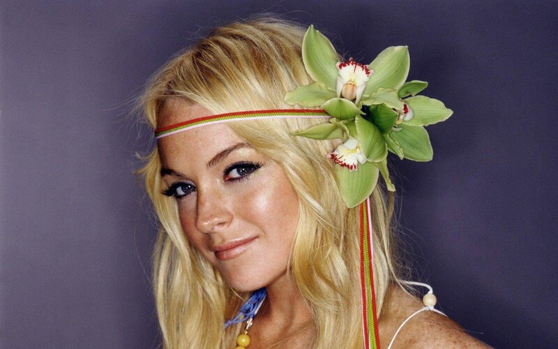 Blonde woman with orchid headband