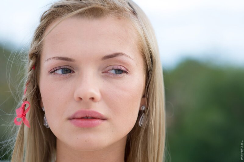 blonde woman with pink ribbon