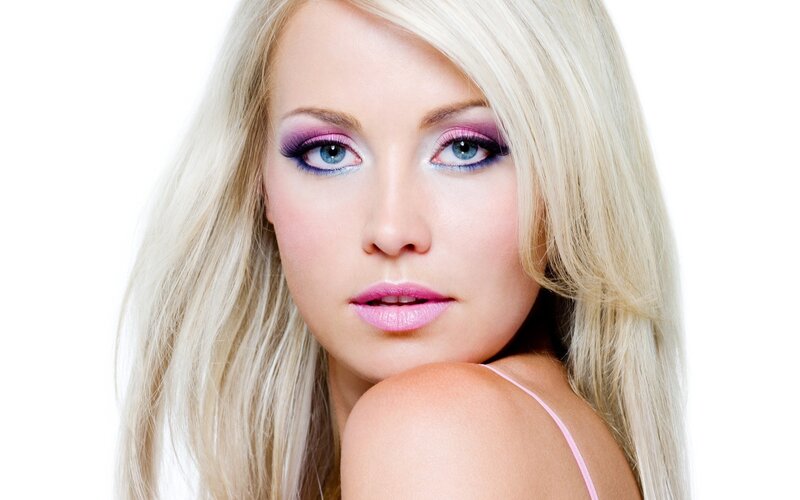 blonde woman with purple makeup