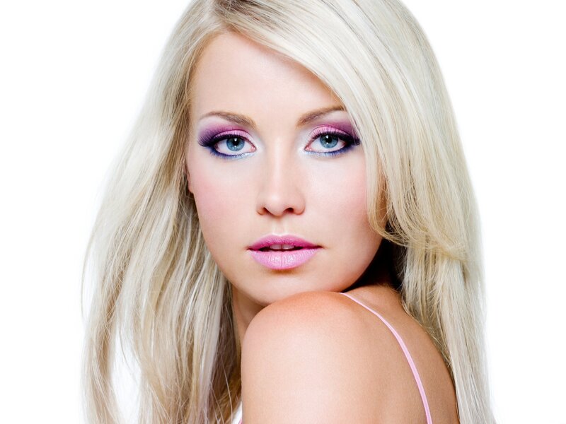blonde woman with purple makeup