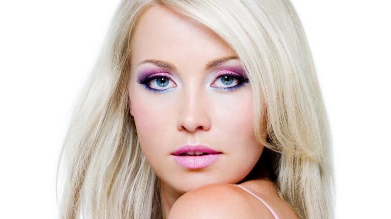 blonde woman with purple makeup