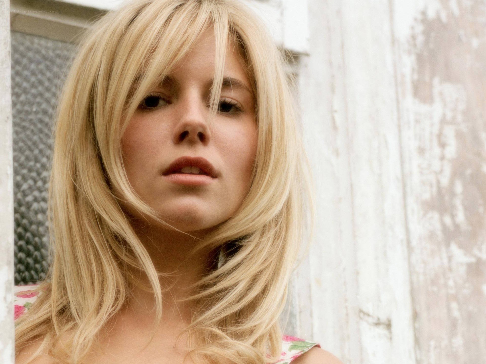blonde woman with thoughtful expression
