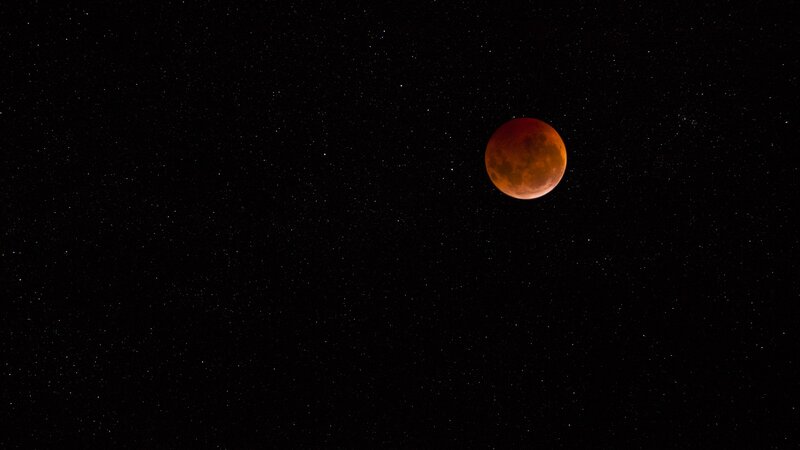 Blood moon in starry sky