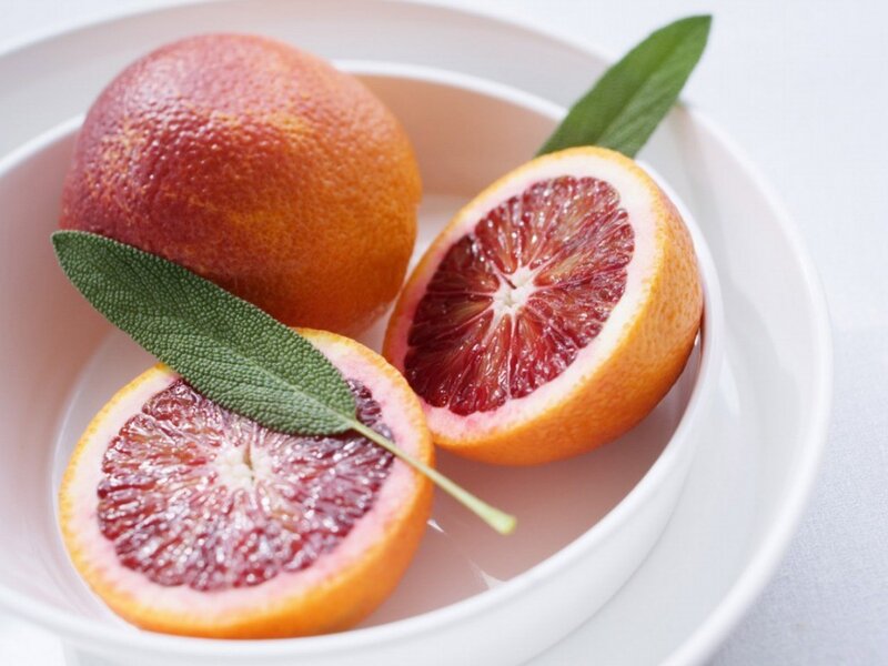 Blood oranges in a white bowl