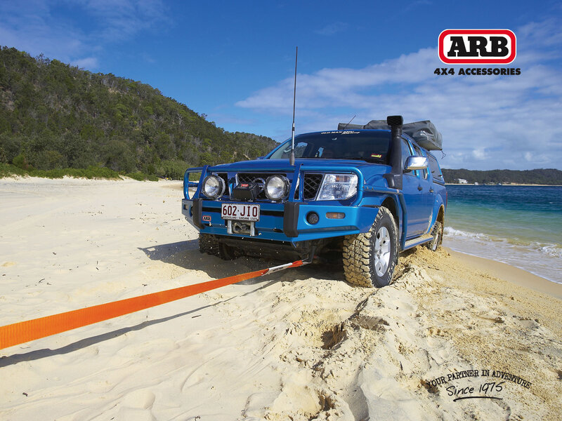 Blue 4x4 on beach