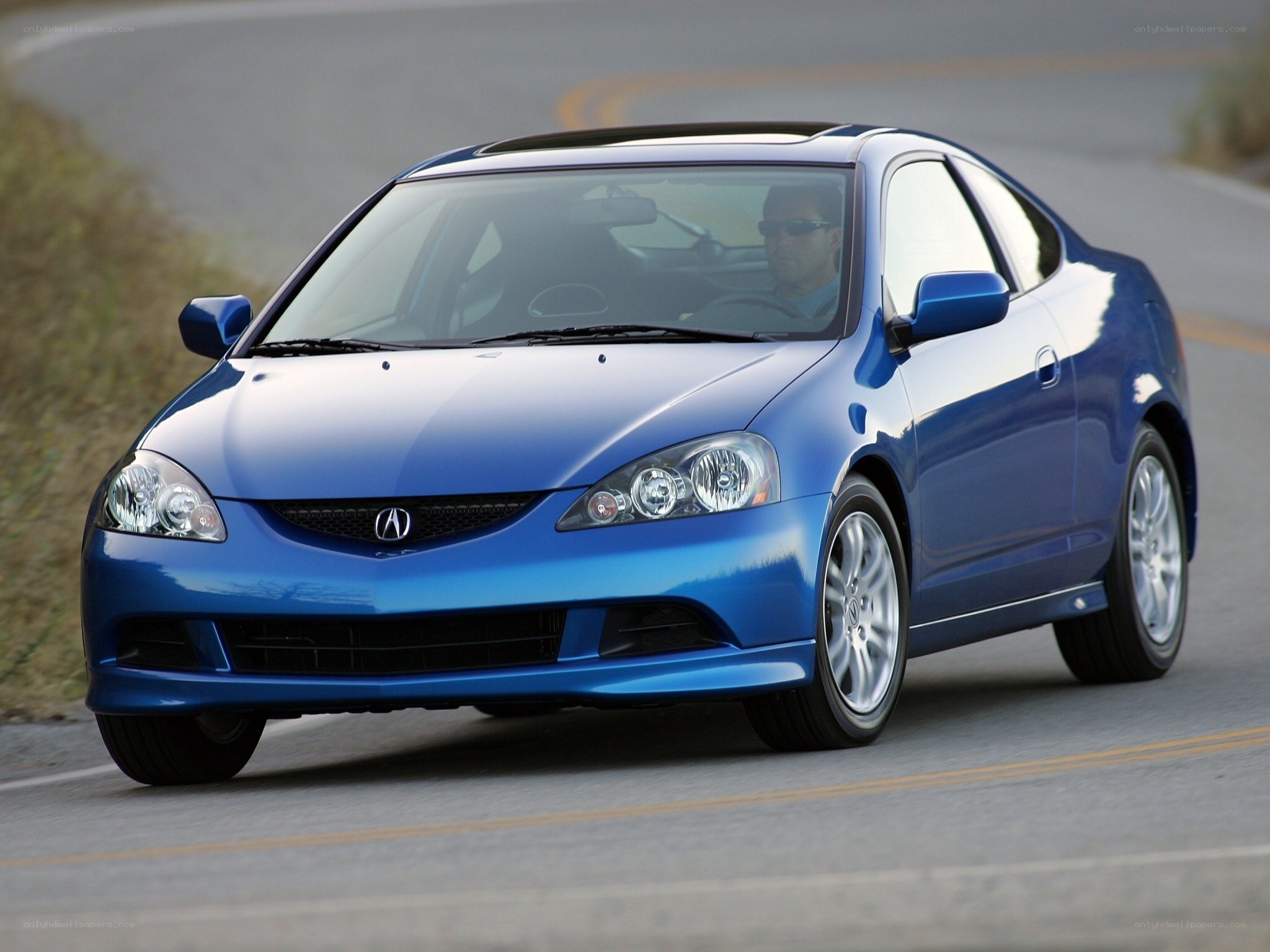 Blue Acura RSX in motion