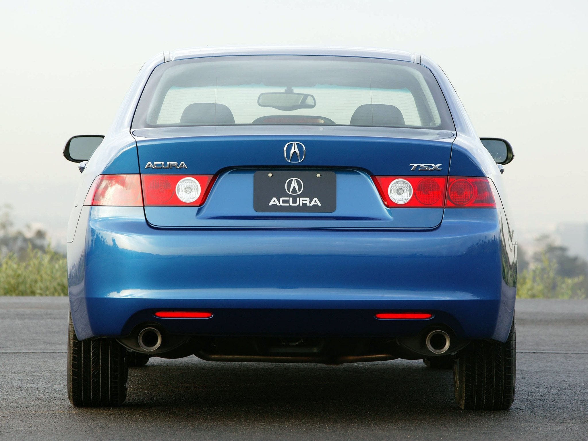 Blue Acura TSX rear view