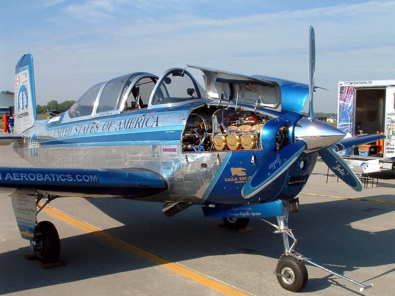 Blue aerobatic aircraft on tarmac