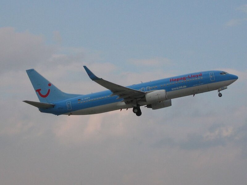 Blue Airplane in Flight — Calm