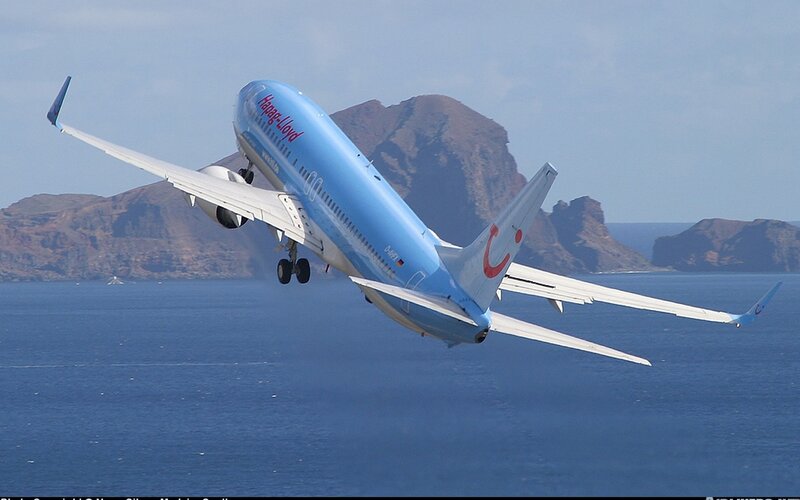 Blue Airplane in Flight