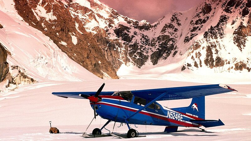Blue Airplane on Snow