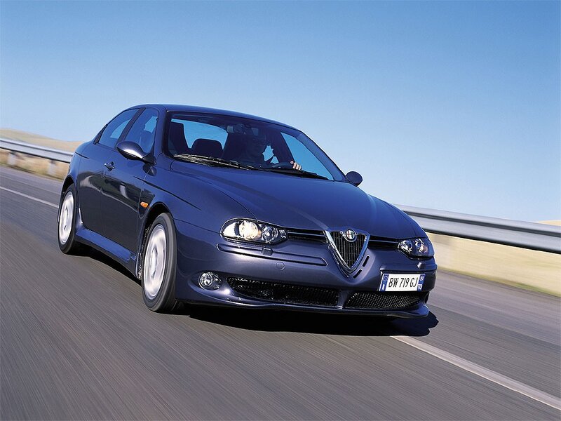 blue alfa romeo driving on road