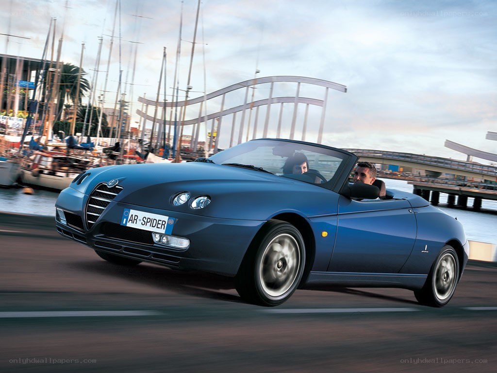 Blue Alfa Romeo Spider driving