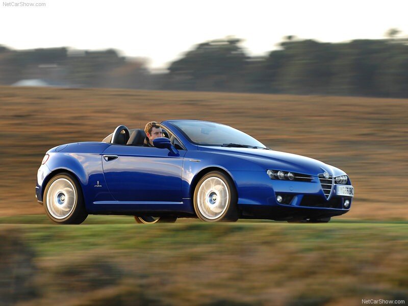 blue alfa romeo spider in motion