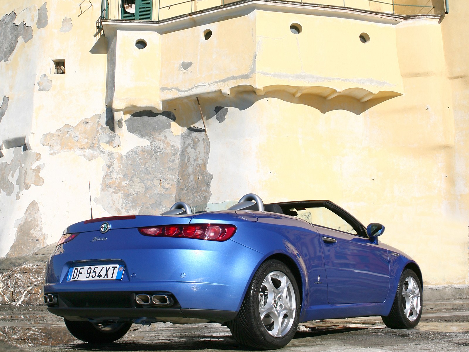 Blue Alfa Romeo Spider parked