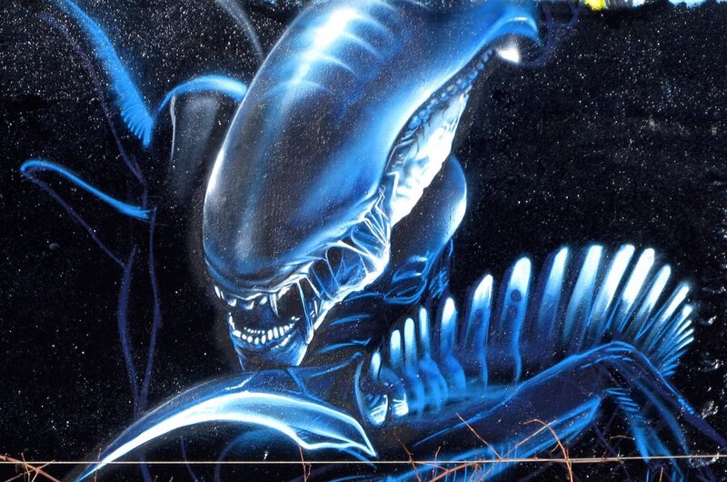Blue alien creature artwork