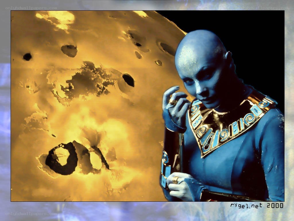 blue alien with golden planet